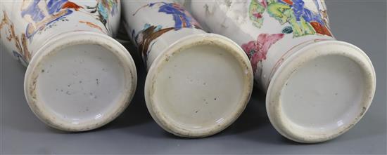 A garniture of three Chinese famille rose eighteen luohan vases, Qianlong period, 14.3cm - 18.5cm, some damage